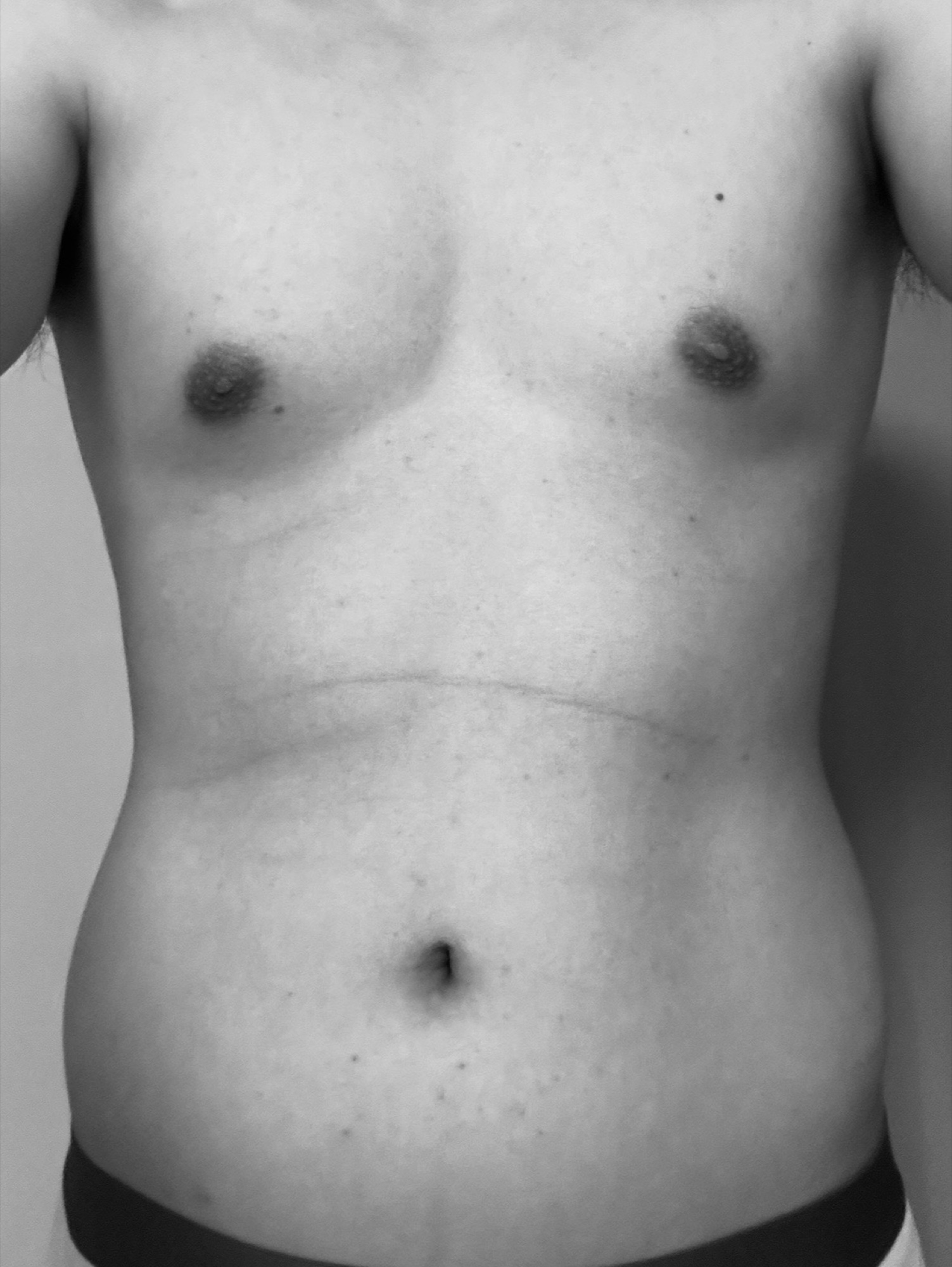 A torso progress check-in photo documenting body composition after training
